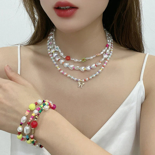Elegant gold-plated necklace set featuring multi-row imitation pearl design, perfect for formal and casual wear