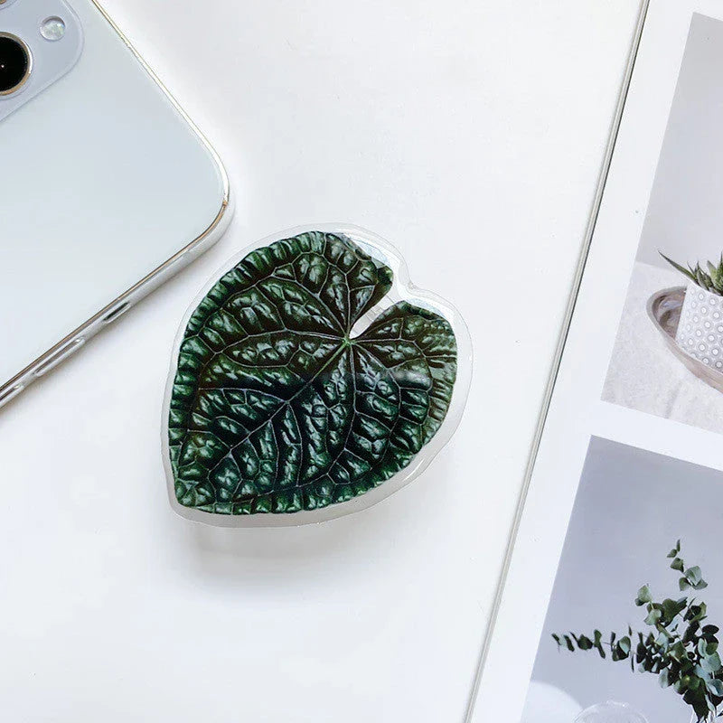 Stylish smartphone stand with leaf-inspired design for secure hands-free support and mobile device versatility