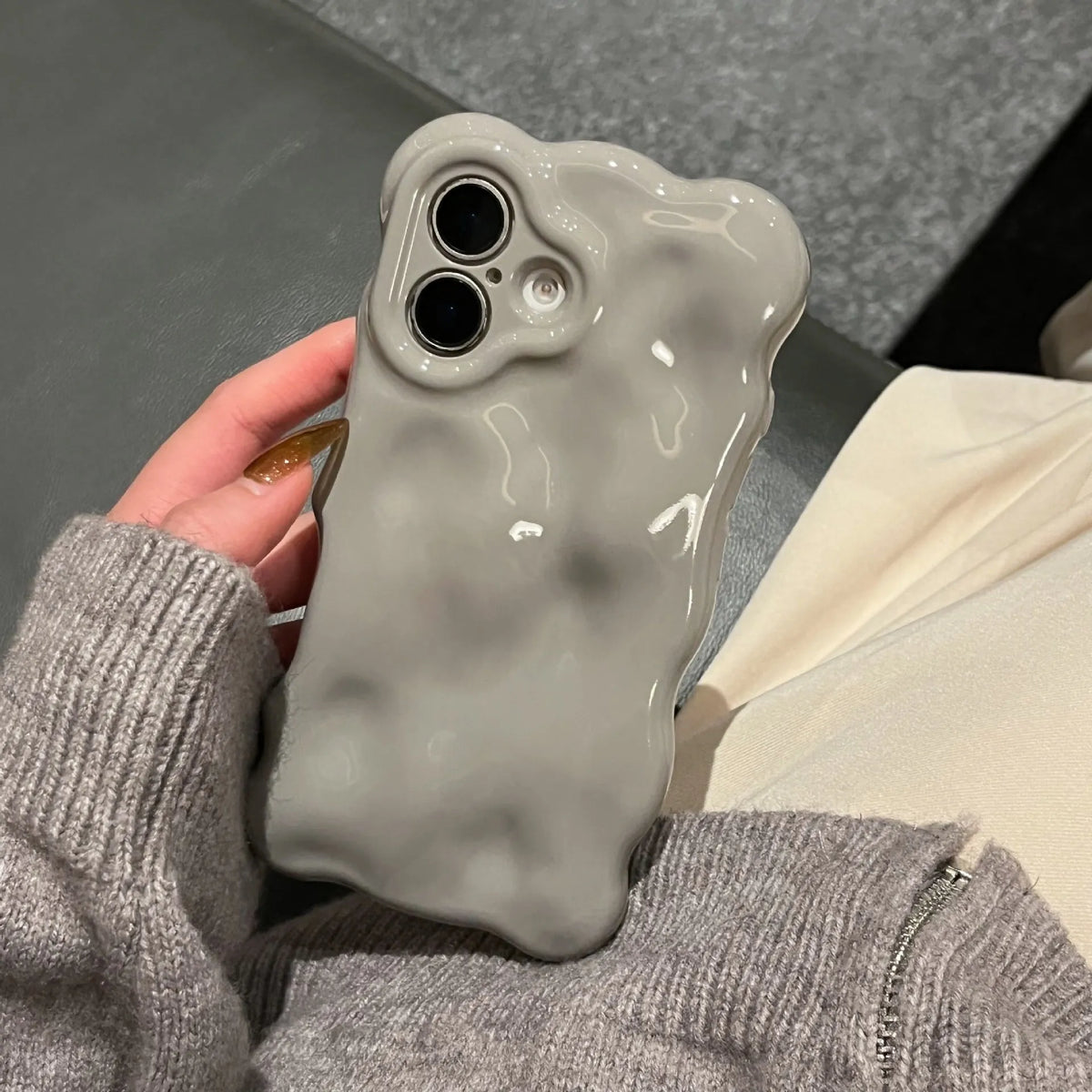 Grey TPU phone case with three-dimensional bubble shell pattern for iPhone 11 to 17 series