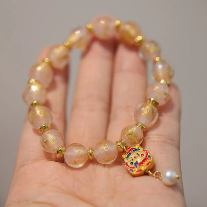 Women's geometric ethnic style bracelet with gold foil decoration on coloured glaze in two colour variations