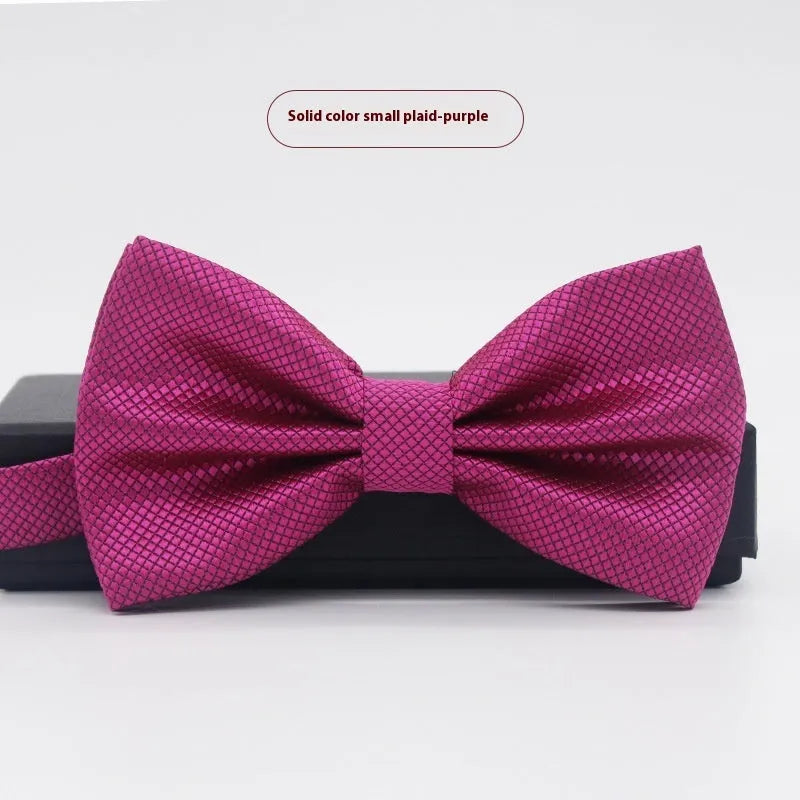 A solid colour pre-tied bow tie with an adjustable neck strap, shown in a classic flat head shape.