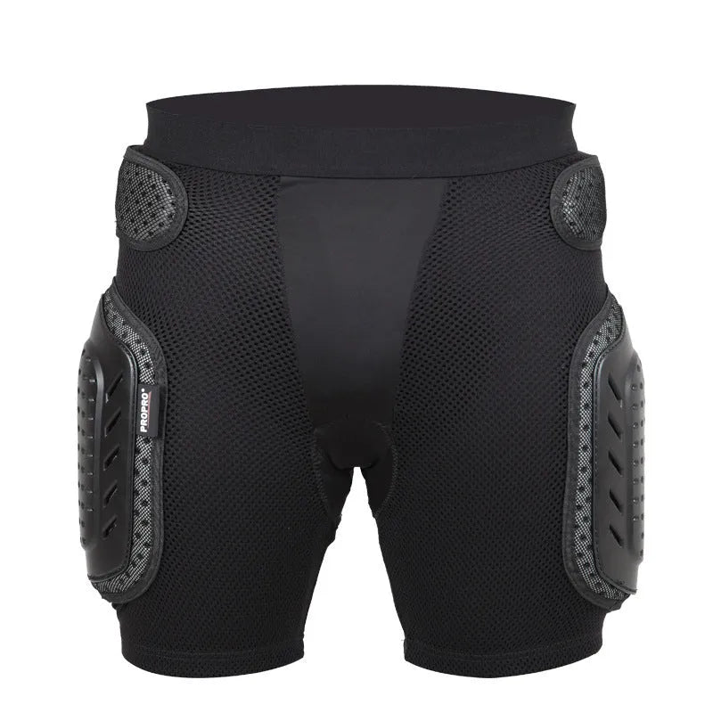 Black cycling hip protection pants shown laid flat, designed for impact safety during sports.