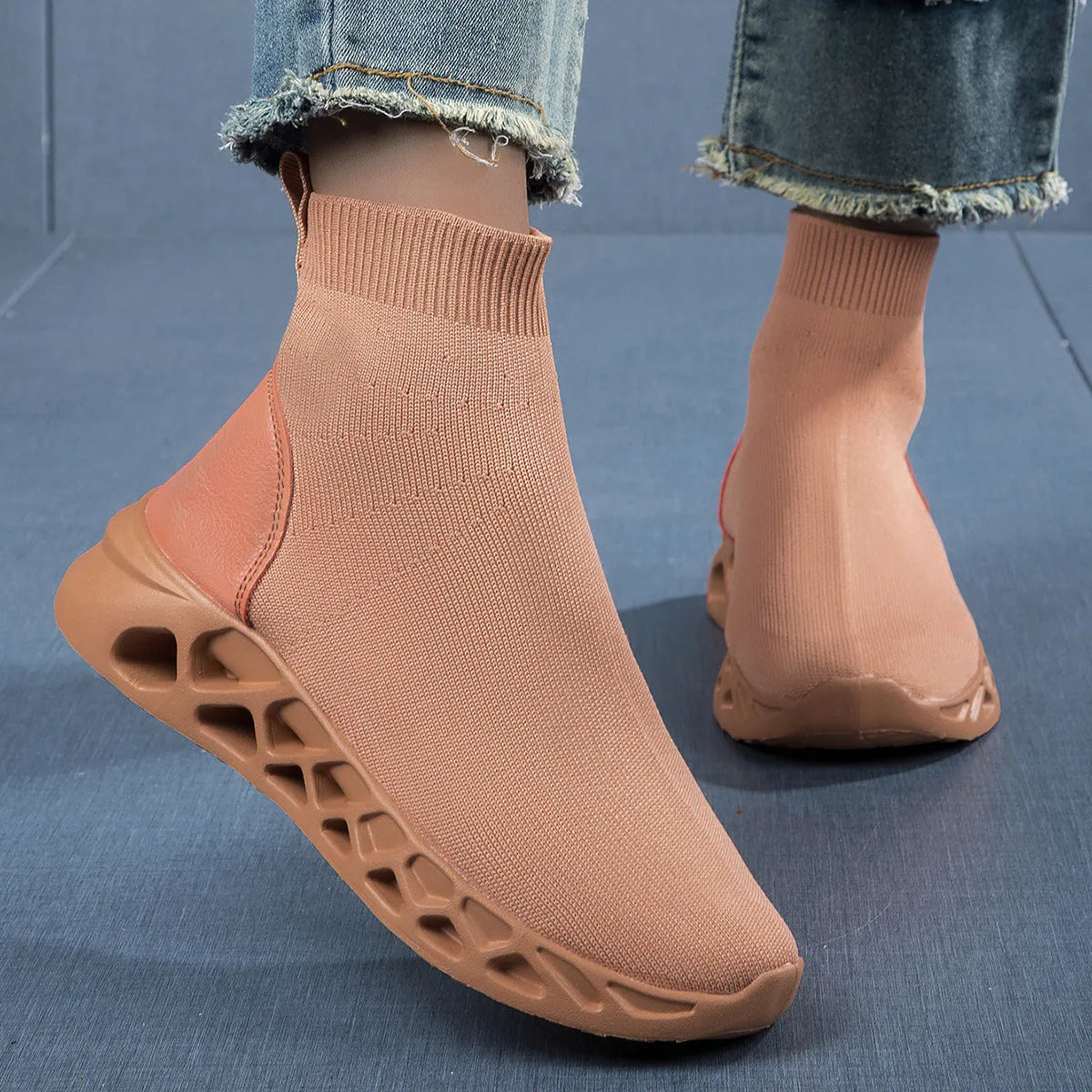 Women's casual mesh slip-on shoes in terracotta colour with flat sole and sewing line detail.
