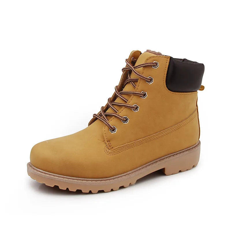 Martin boots with lace-up front, round toe and flat low heel in pink with velvet lining