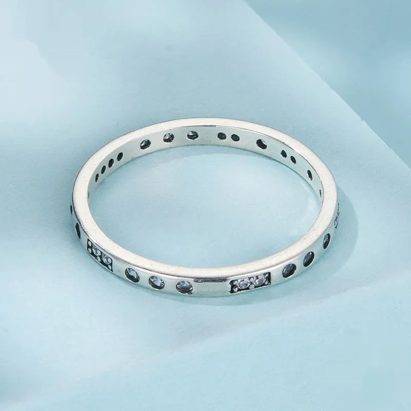 Silver alloy Moss Password I Love You ring with oxidised black finish, shown in size 7 on a model finger.