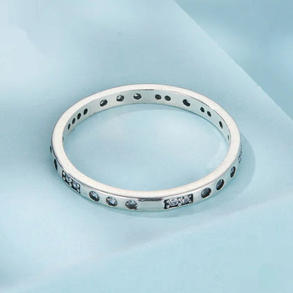 Silver alloy Moss Password I Love You ring with oxidised black finish, shown in size 7 on a model finger.