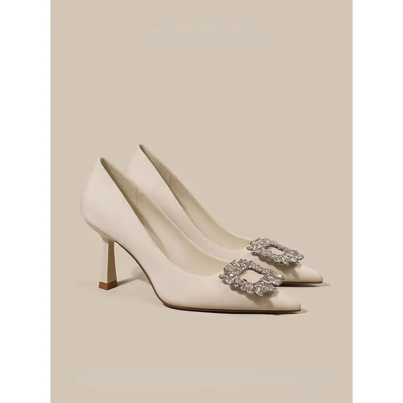 Women's pointed toe stiletto high heels in beige and black colours with low top design