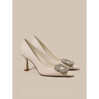 Women's pointed toe stiletto high heels in beige and black colours with low top design