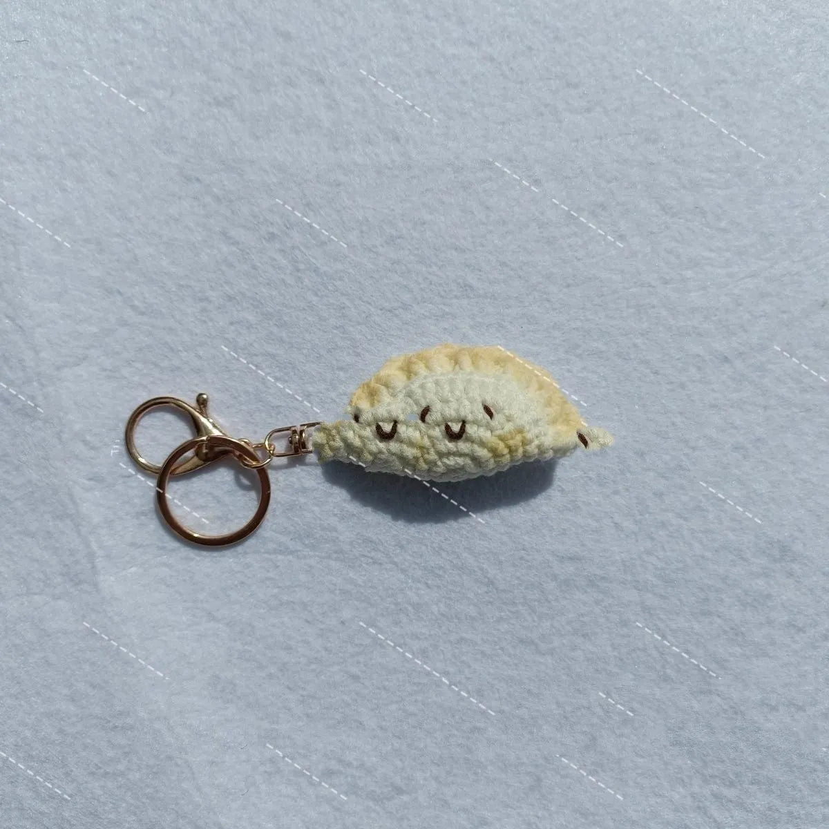 Handmade crochet dumpling pendant with keychain in plush fabric