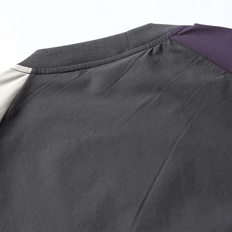Dark grey men's loose fit t-shirt with contrasting colour raglan sleeves.