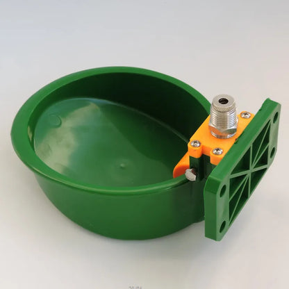 Green plastic automatic water drinking bowl for sheep and pigs on farm