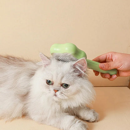 Green and yellow stainless steel self-cleaning cat comb for de-shedding, measuring 20cm.