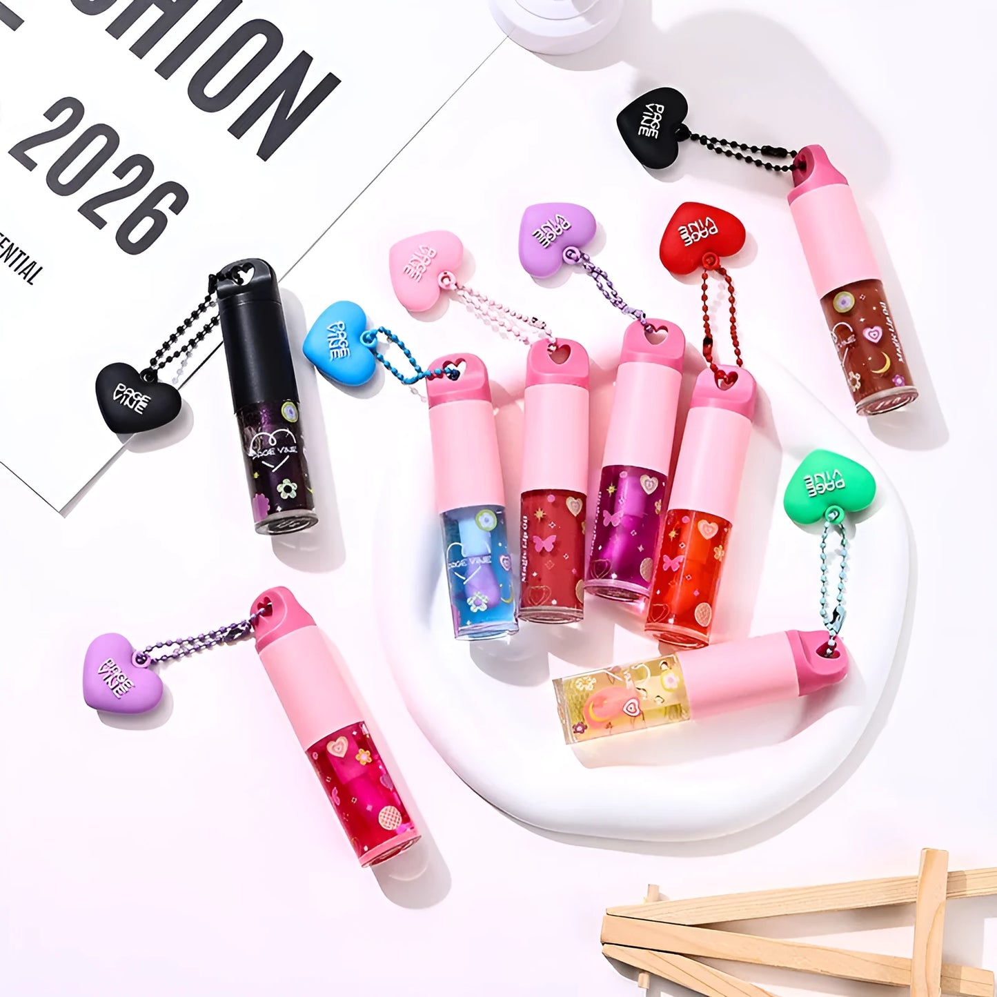 Colour-changing lip gloss with love pendant charm on applicator, from the Princess series.
