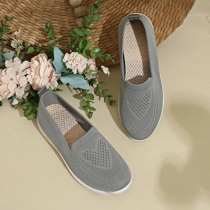 Plus size women's beige casual cloth shoes with low top, flat heel, and heart pattern.