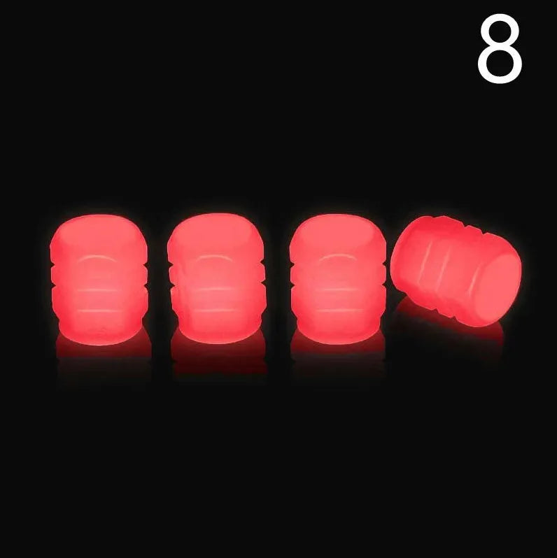 Glow-in-the-dark rubber tyre valve caps in five colour options on tyre valve stem