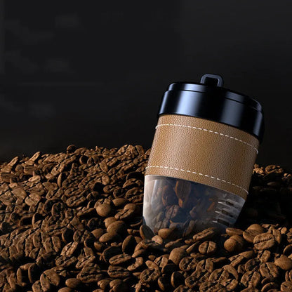Solid coffee cup shaped car air freshener in plastic, shown in brown colour on a car dashboard.