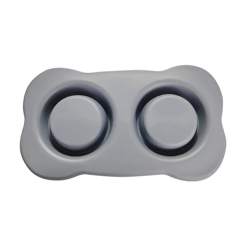 Large silicone dog bowl with stainless steel insert in five colour options on kitchen floor