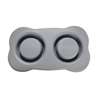 Large silicone dog bowl with stainless steel insert in five colour options on kitchen floor