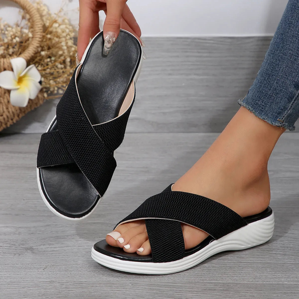Black women's flat wedge slippers with a peep-toe fish mouth design and thick rubber sole