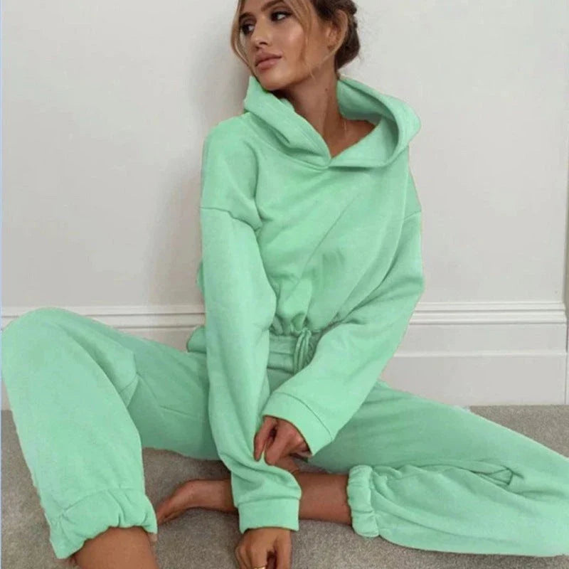 Stylish 2-piece athleisure sets for women in a variety of vibrant colors, including pink, purple, black, blue, and more.