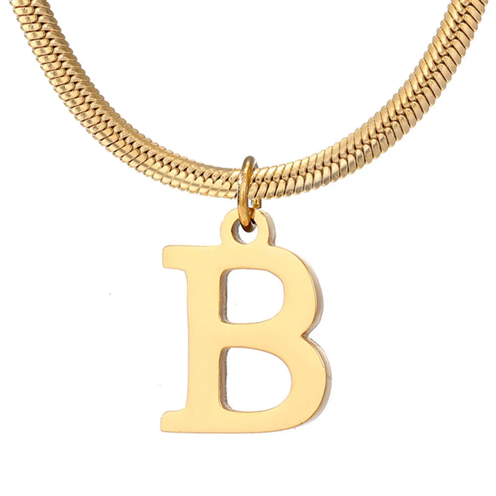 Elegant gold A-Z letter pendant necklace on a snake chain