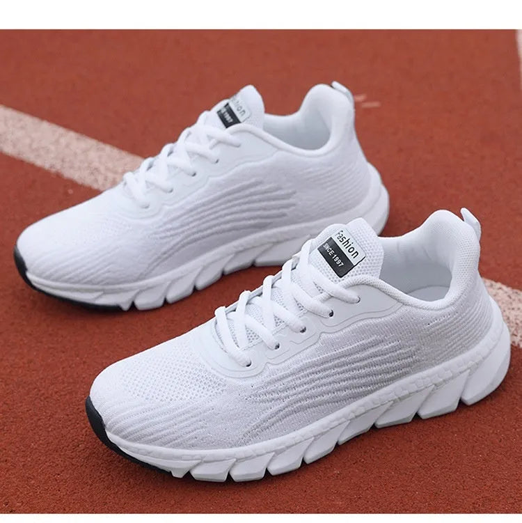 Women's black and white low-top casual running sneakers with round toe and MD soles