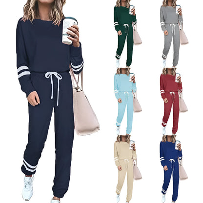 Women's loose-fitting plus size casual suit in a cotton blend, shown in a solid colour with a half-sleeve top and trousers.