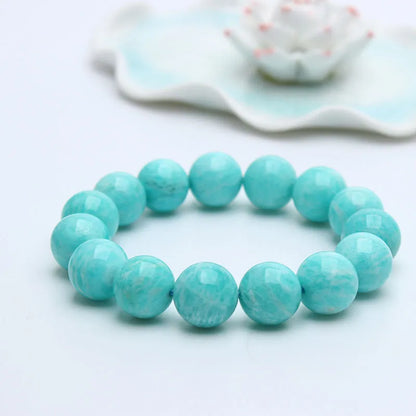 Amazonite gemstone bracelet with green-blue beads on a wrist