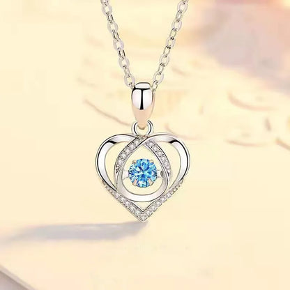 Blue diamond heart-shaped pendant necklace and matching bracelet set on a copper chain.