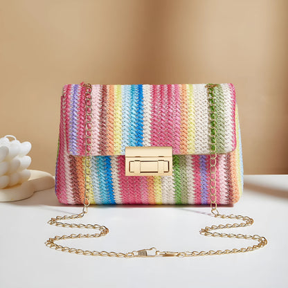 Women's small square straw cross-body bag with lock closure, shown in rainbow colour.
