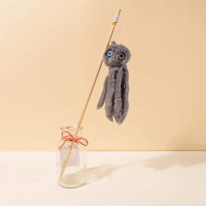 Octopus-themed furry cat toy attached to a long stick, shown in pink colour.