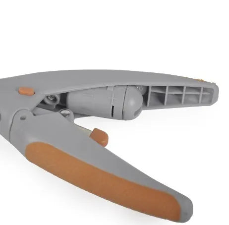 White plastic pet nail clipper with LED light on blister card packaging.