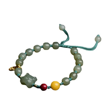 Natural Hetian Jade bracelet with animal Zodiac designs and cinnabar beeswax accents