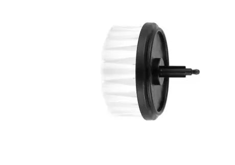 Green electric cleaning brush with multiple brush heads on a kitchen worktop.