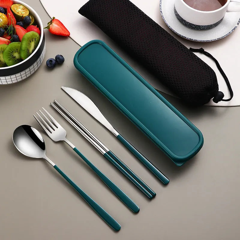 Gold and black stainless steel knife fork spoon set inside a grey mesh carrying bag.