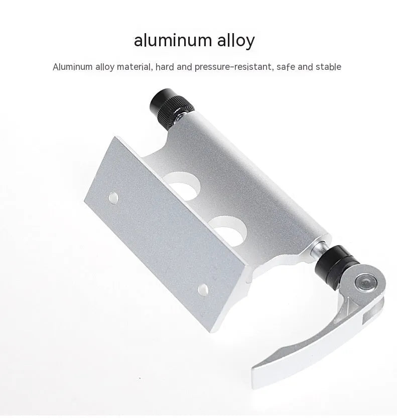 Silver metal bicycle front fork quick release clamp for mounting to a car bike rack.