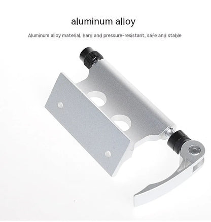 Silver metal bicycle front fork quick release clamp for mounting to a car bike rack.