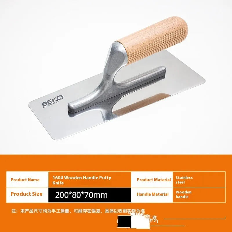Stainless steel putty scraper with wooden handle shown in three different blade sizes on a workbench.