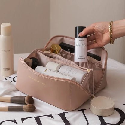 Premium PU leather cosmetic bag with large capacity, versatile storage, and water-resistant design for modern women on the go