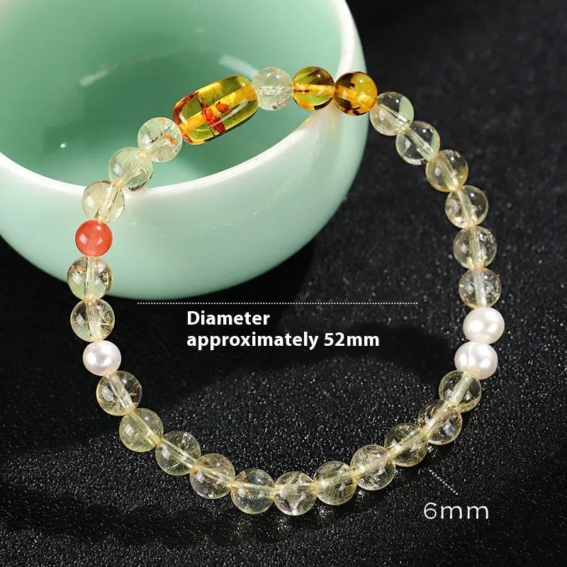 Handmade women's crystal beaded bracelet with freshwater pearls and small Buddha charm