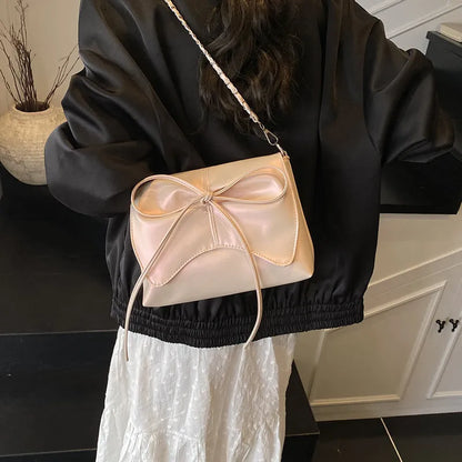 Black horizontal square PU crossbody bag showing internal mobile phone pocket and crossbody strap