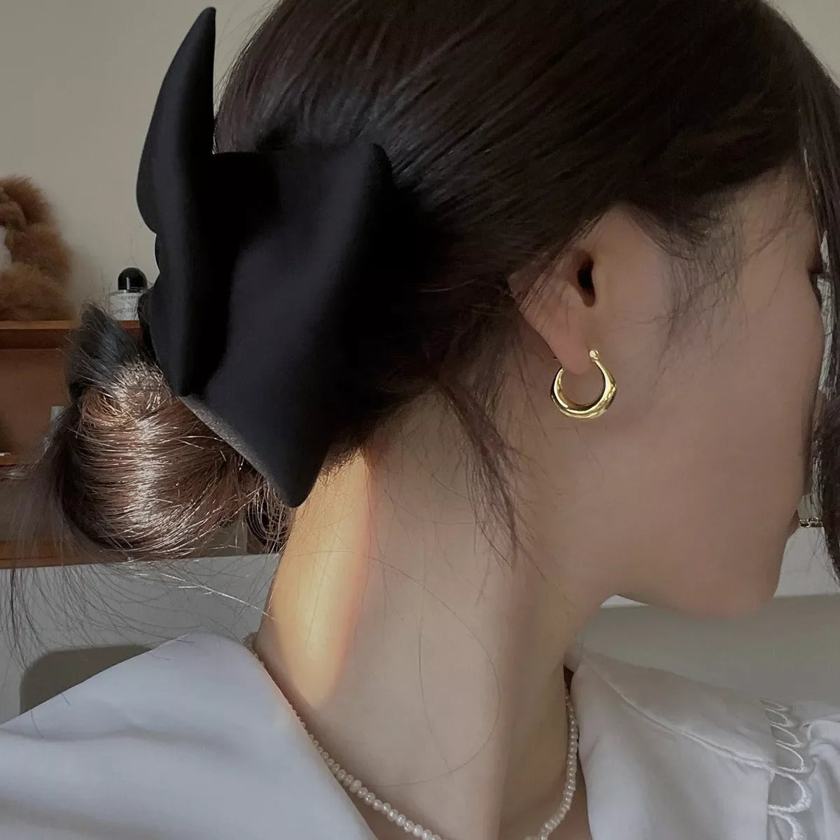 Small fat circle ear clip bracelet in white gold and yellow gold colours