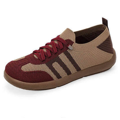 Retro style casual training shoes in flyknit mesh with a soft PU sole and flat heel.