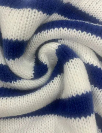Sapphire blue striped knitted pullover sweater with round neck and long sleeves on a hanger.