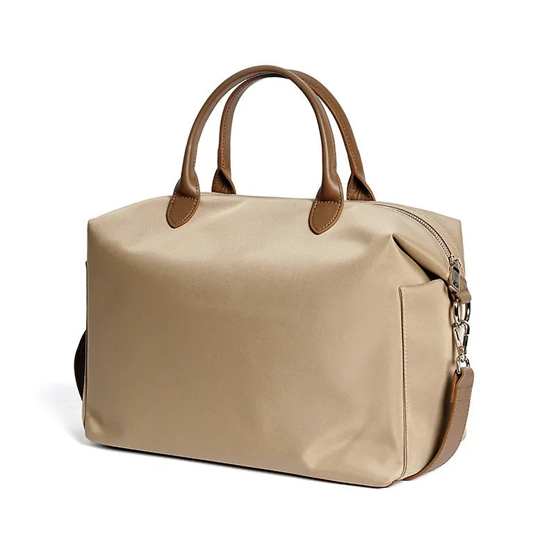 Waterproof nylon shoulder bag with leather accents in black or light khaki, showing 35cm width.