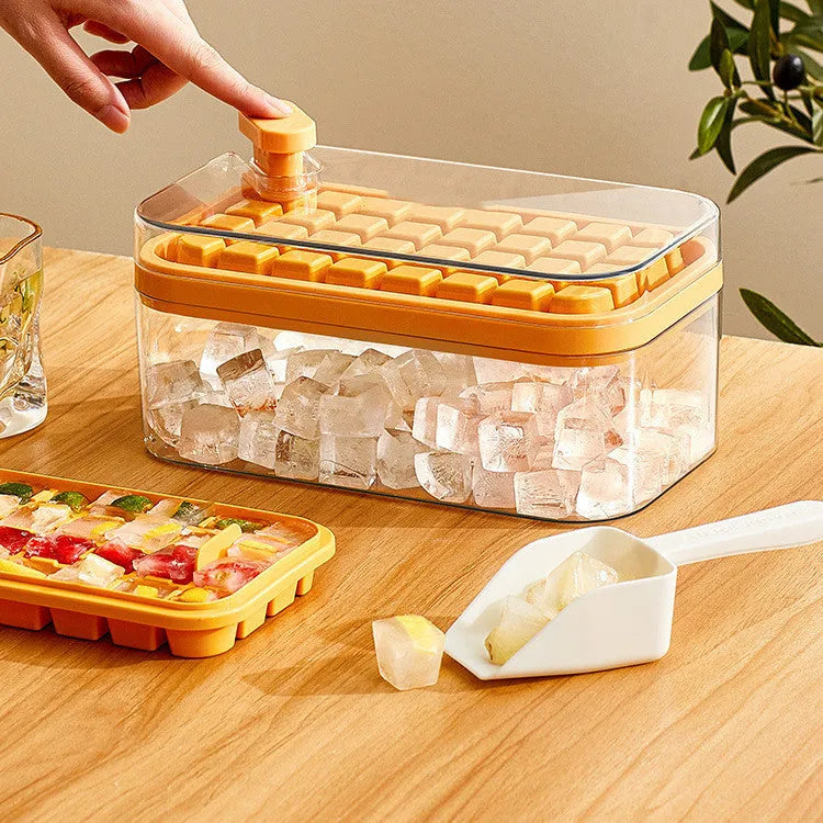 Green one-button press ice mould box with storage lid and ice shovel on kitchen counter
