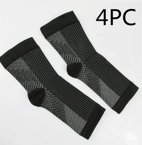 Anti-fatigue compression foot sleeve in black, red, or white, featuring moisture-wicking fabric and a heel hole for breathability.