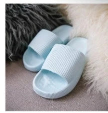 Cozy slip-on slippers in various colors for men and women, featuring soft fabric upper and non-slip EVA soles