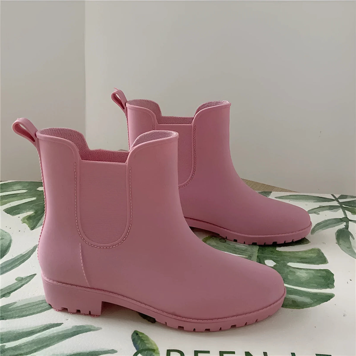 Pair of short casual PVC rain boots with non-slip sole and 3-5cm mid heel, shown in pink, milky white, and black
