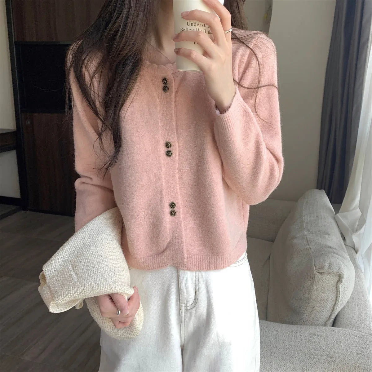 Women's milky white long sleeve acrylic cardigan sweater worn open, showing free size fit and regular sleeve design.